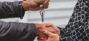 Person Holding Silver Key
